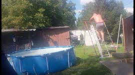 Person tries to jump into pool in Drogoszewo, Poland