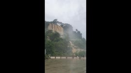 Flash floods turn mountain into giant waterfall in Vietnam