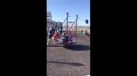 Child screams on fast merry-go-round in Nampa, Idaho, USA