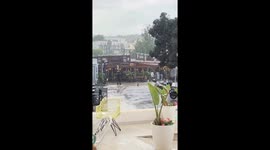 Trash bin swept away by flood waters during rainstorm in Santa Ponça, Spain