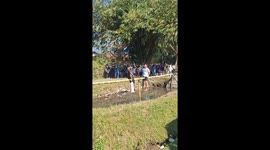 Two men fall into water during Indonesian Independence Day pillow fight