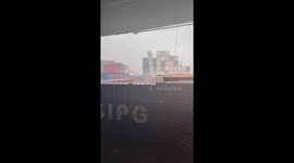 Shipping containers topple over like giant Jenga tower