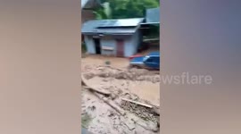 Raging floodwater washes away car in northern Thailand
