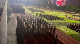 Military recruits balance water bottles on heads with perfect precision during drills in China