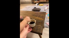 Toddler drinks coffee with pacifier in Erzincan, Turkey