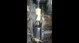 Satisfying footage shows piece of wood carved into rod and three rings