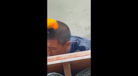 Pet parrot joins fisherman at work