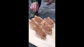 Skilled craftsman creates walking wooden chicks