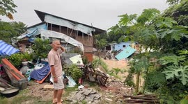 Houses collapse into river as heavy rain continues to batter northern Thailand