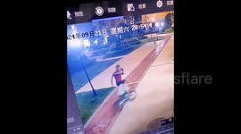 Boy kicked off bicycle by unprovoked man in residential complex in China