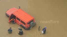 Television News Team conducts interview in a severe flood in Thailand