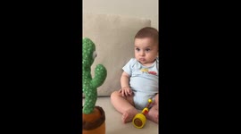Baby gets scared by talking cactus toy
