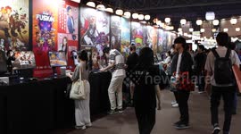 Japan: Visitors of Tokyo Game Show 2024 play video games in Chiba
