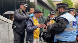 UK: Protesters who gathered outside Southwark Crown Court are stopped and searched by police
