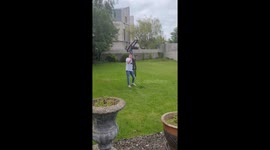 Man Balances A Bike On His Chin