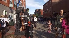 Frankenstein's Monster Takes A Photo With A Child In Salem, Massachusetts