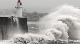 Massive waves overtop lighthouse in Cornwall as 60mph winds blast Cornwall and the south coast
