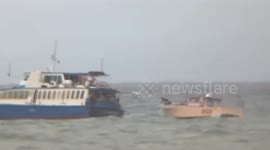 Philippine Coast Guard tows stranded speedboat as Typhoon Krathon approaches the Philippines