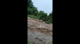 Flood waters destroy road in Acapulco, Mexico