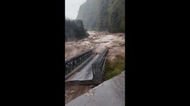 Bridge swept away by flood waters in Tatopani, Nepal