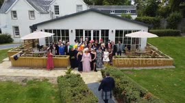 Couple stun family and friends by marrying at 'secret proposal' party