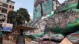 India: Workers and Artisan decorate a model of hills portraying natural calamities