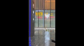Strong wind breaks passerby's umbrella