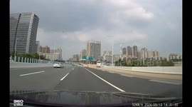 Truck collides with car changing lanes on highway in Guangdong, China