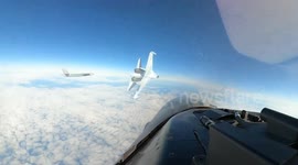 Russian fighter jet speeds in front of US plane narrowly avoiding crash in Alaska