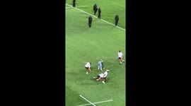 Pitch Invaders Disrupt Prize Ceremony and Get Tackled