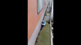 Train driver shimmies along 100ft high bridge girders to fix carriage