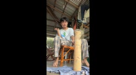 Dilligent saver cracks open his bamboo pole piggy bank