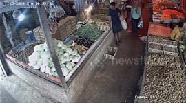 Wild boar charges through market and attacks passerby in Indonesia
