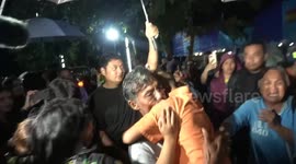 Family of Thai school bus fire survivor break down in tears when they see him return home