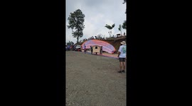 Flying bamboo hut soars across valley