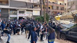 International Press members gather by bombed Dahieh suburb