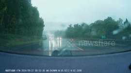US: Couple's Close Call with Mudslide Captured on Camera During Hurricane Helene