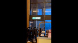 Hotel staff desperately try to prevent revolving door from spinning in Typhoon Krathon winds
