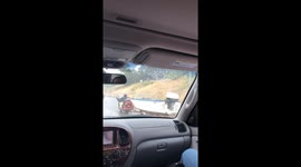Guy Pulls Boat With Motorcycle