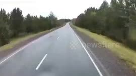 Russia: Trucks from both sides of road overtake and collide head on before being rear ended by a third lorry