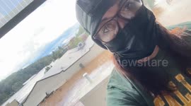 Person rescued from roof during floods in Asheville, North Carolina
