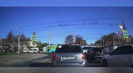 Russia: Girl crossing road on scooter crashes into moving minibus and bounces off