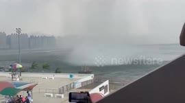 Locals scream as huge waterspout tornado approaches buildings