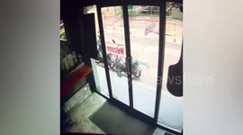 Cement truck plunges into sinkhole outside pizza shop