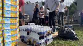 Volunteers distribute supplies to Hurricane Helene survivors