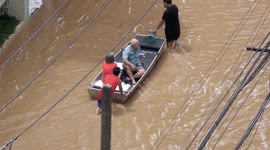 The Ping River in Chiang Mai flooded overnight,causing tourists and locals to be evacuated from the hardest- hit areas