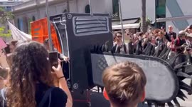 Students protest university cuts with symbolic chainsaw in Córdoba, Argentina