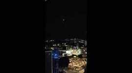 Iran missiles strike Israel as shocked migrants workers watch from balconies