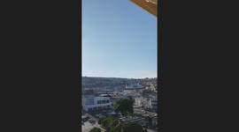 Shocked residents watch Iranian missiles hit Israel