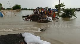 Residents stranded when bridge collapses in India floods